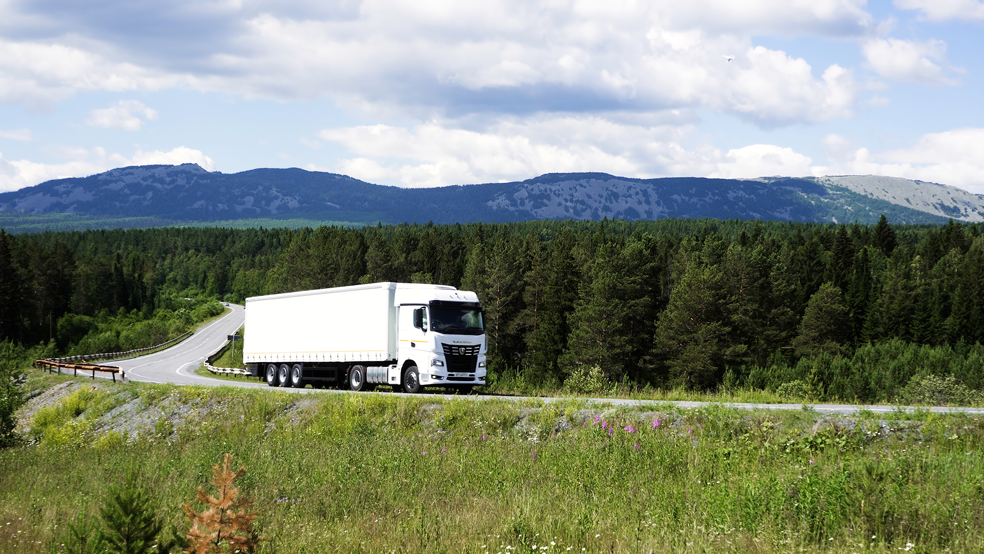 big-trucks-moving-on-a-summer-road-scene-cargo-t-2026-03-17-00-41-13-utc